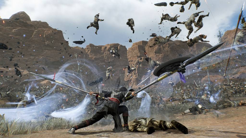 The Wanderer skillfully wields twin pikes against a massive army in Dynasty Warriors: Origins